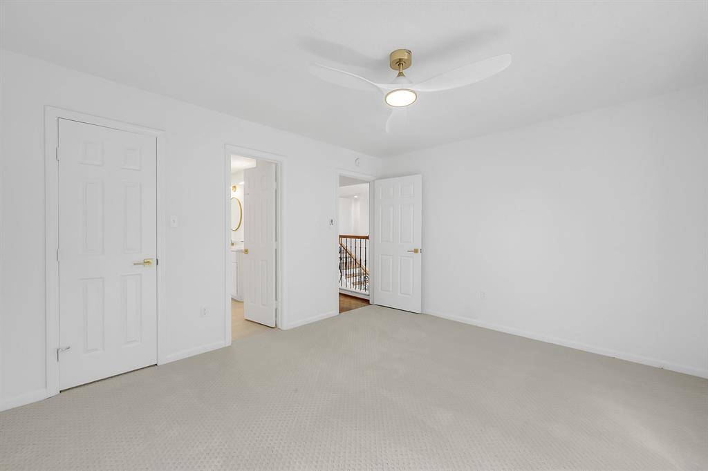 A reverse view of this front facing bedroom shows its walk-in closet and jack n jill bath.