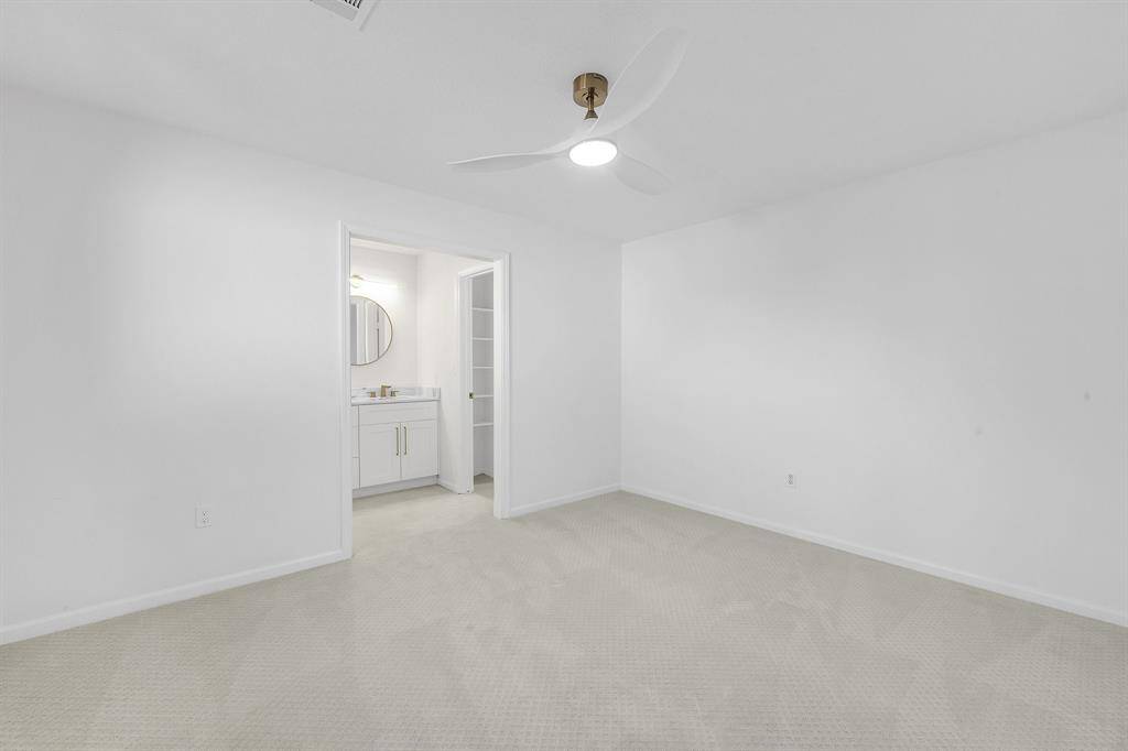A reverse view of this bedroom shows its hollywood style jack n jill bath connection.