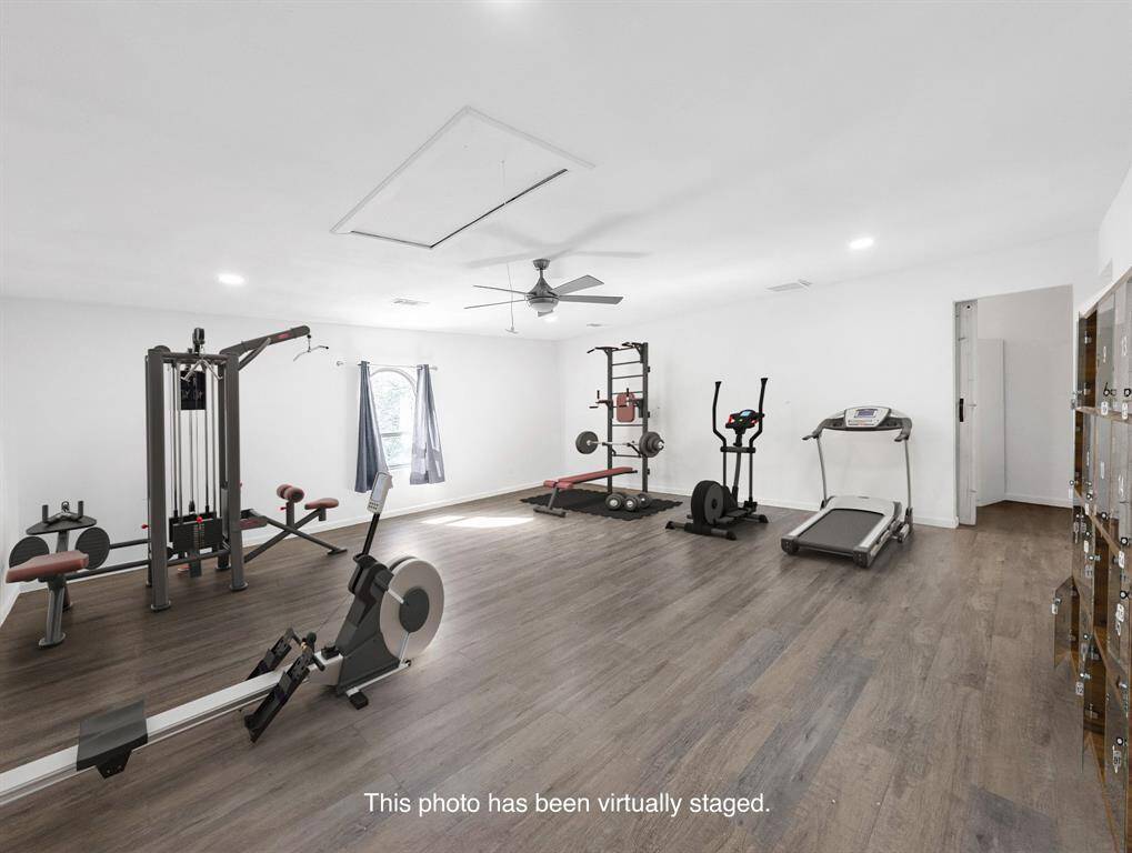 Above the garage, accessed by a full staircase, is this expansive flex room. Virtually staged as a home gym, this space is ideal for fitness, homeschooling, a private guest quarters, business suite, music room, or whatever your needs are!