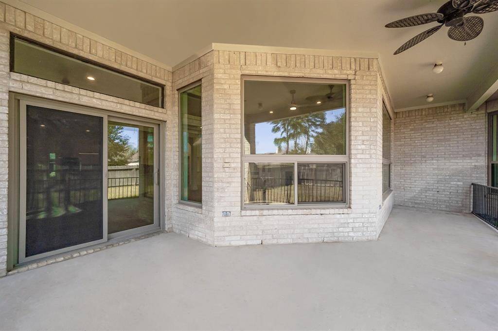 This view of the patio shows off the home’s multiple large energy efficient windows and sliding doors—ideal for indoor/outdoor entertaining.