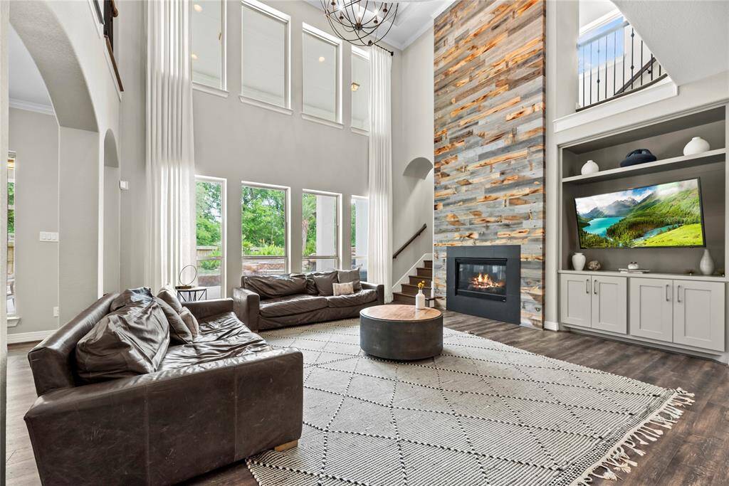 Welcoming and conveying warmth, the living room offers an inviting space for evening movies or holiday gatherings. Tune into your favorite streaming show, while admiring the cozy fireplace.