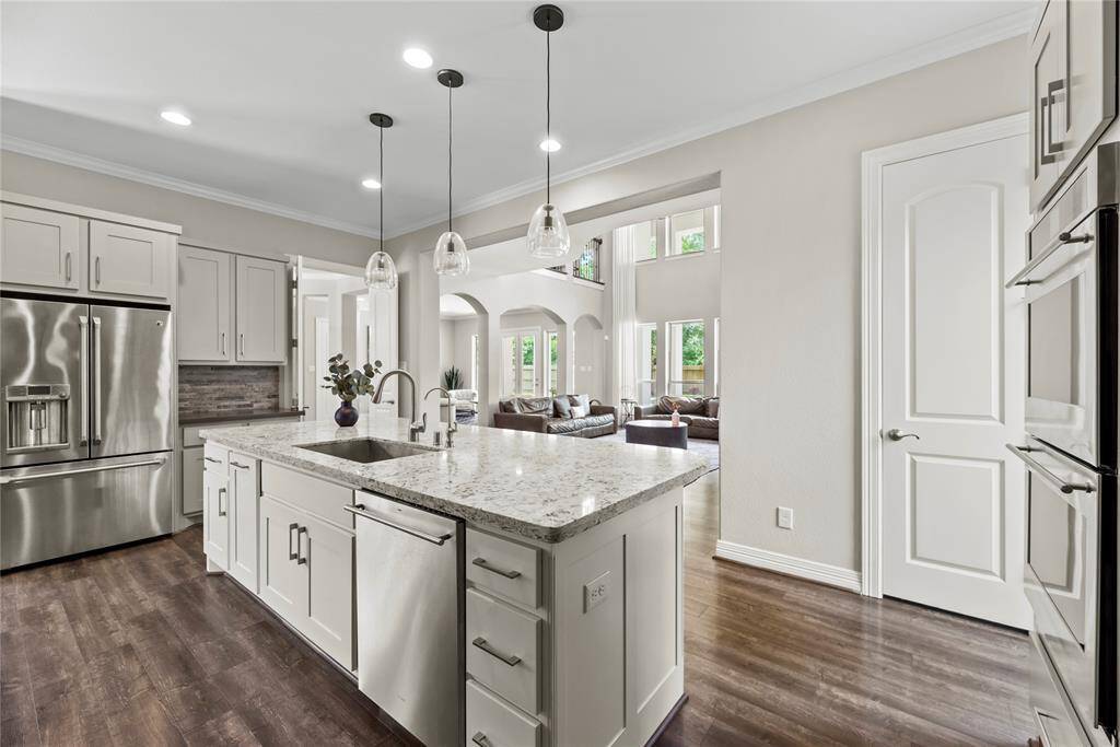 Entertaining is a breeze with an open-concept kitchen and living area. Whip up appetizers for your guests in your air-fryer or enlist their help to bake several dozen cookies for the upcoming charity bake-sale!