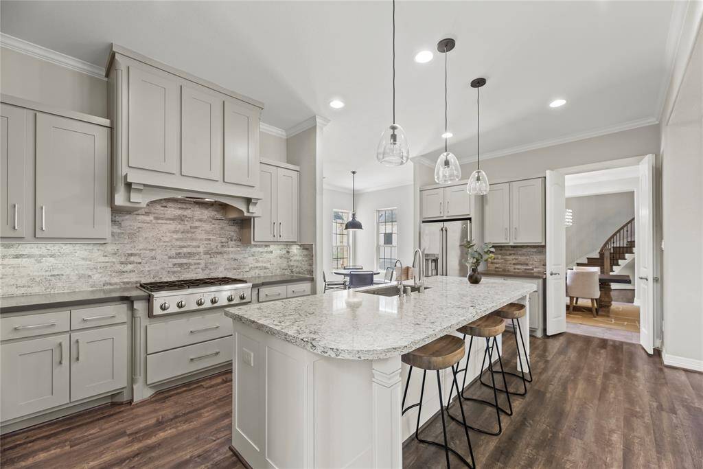 Boasting impressive storage, the center island also features an outlet for easy mixing and prepping with small kitchen appliances. Store cookie cutters and cupcake supplies beneath for impromptu baked goodies, which of course always require an urgent need!