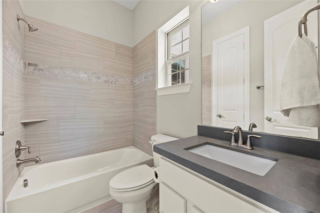 The private guest suite features a private full bathroom and a walk-in closet.