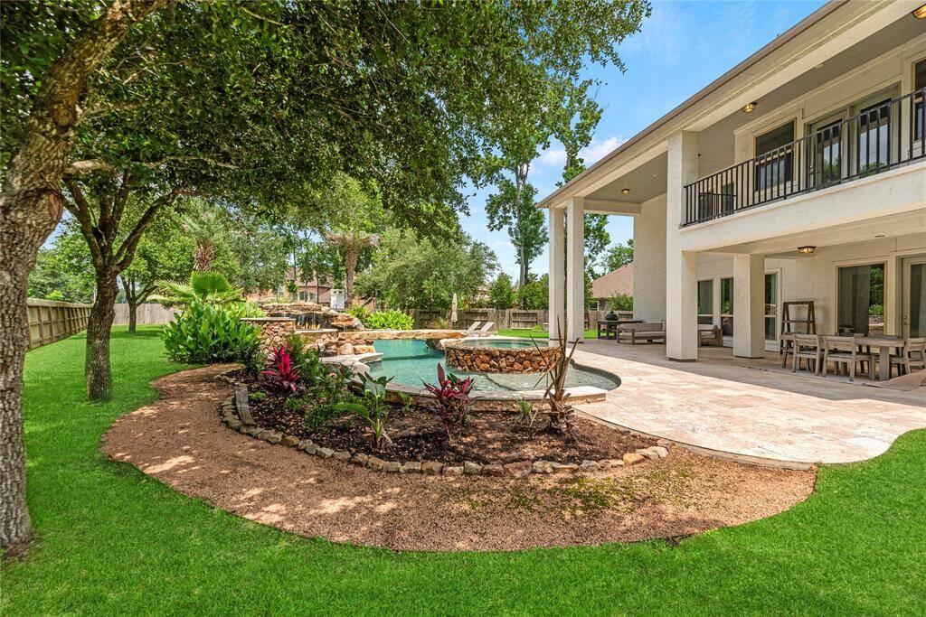 The wide patio has tons of space for al fresco dining. Chat with friends over cocktails, as the kiddos and dogs play in the fully fenced-in backyard.