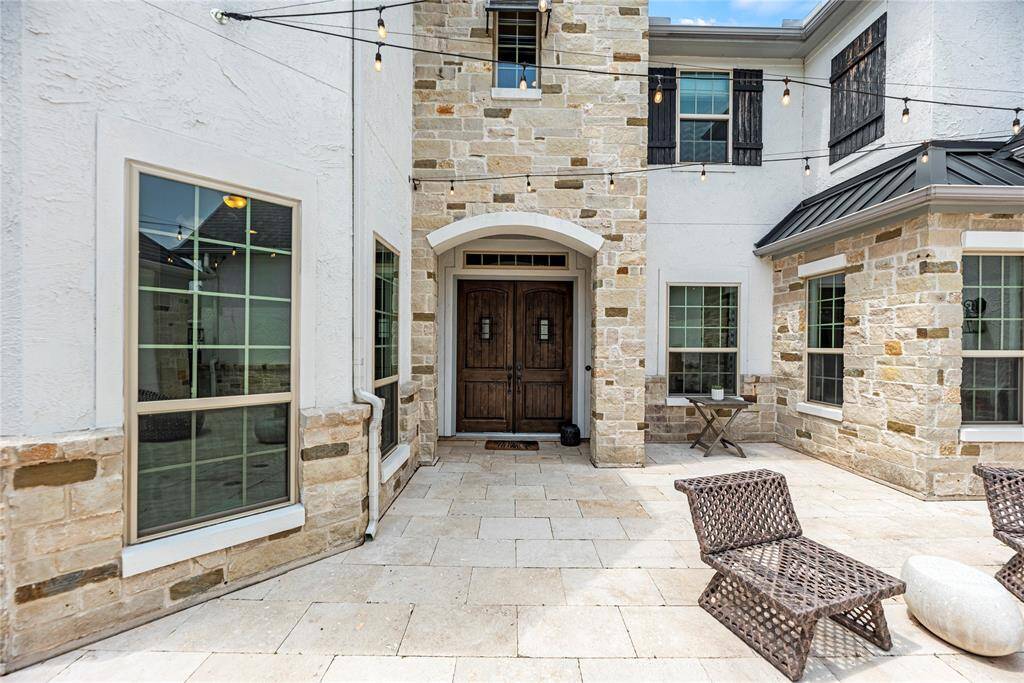 Elegant solid wood double doors greet visitors, setting the tone for a home that reflects a true appreciation for life’s finer details.