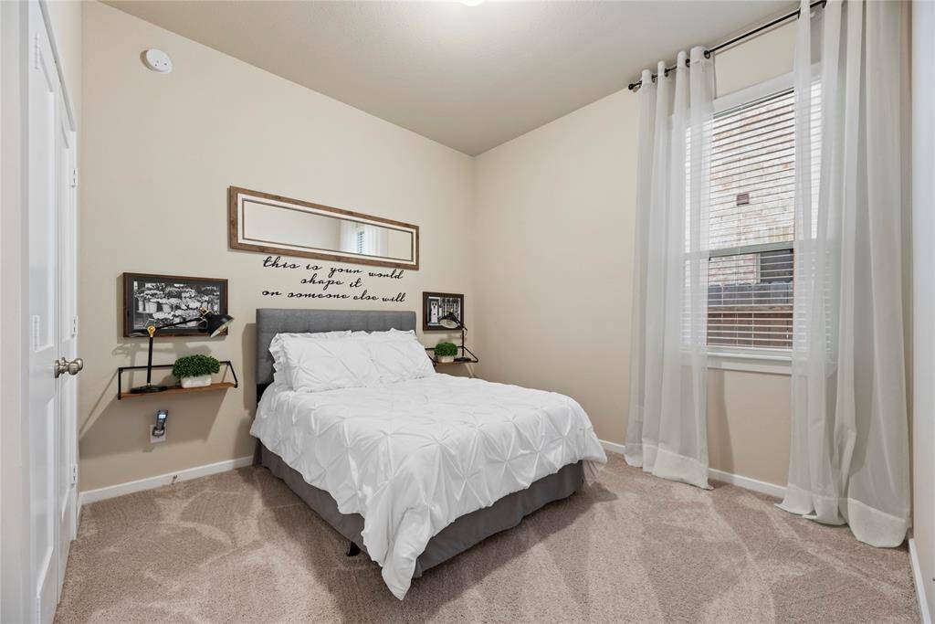 Spacious secondary bedrooms offer plush carpet and large closets.