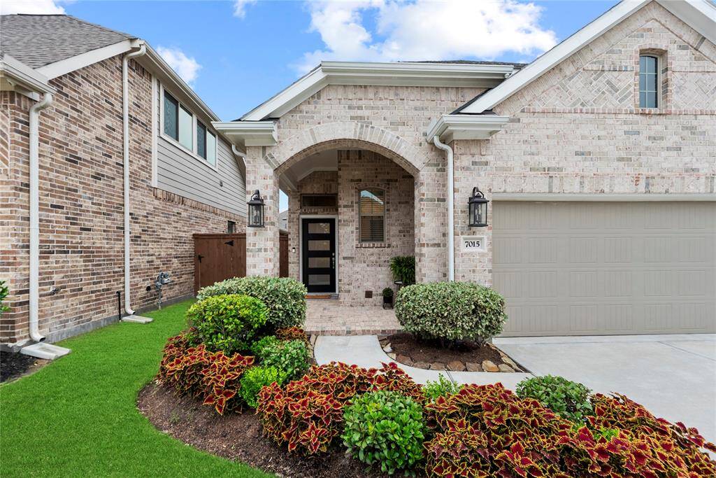 Charming 1-story home with a 2-car garage and lovely landscaping in master-planned Elyson.