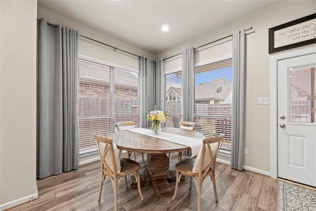 Light and bright breakfast area with backyard views.