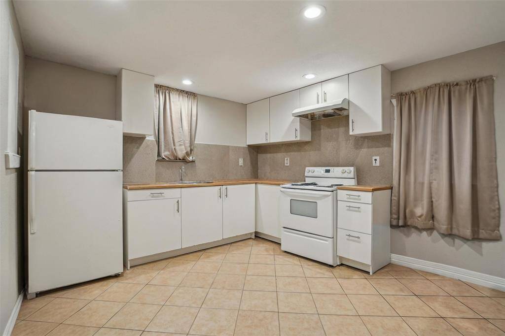 Unit 3 kitchen. [virtually removed all personal items to showcase space]