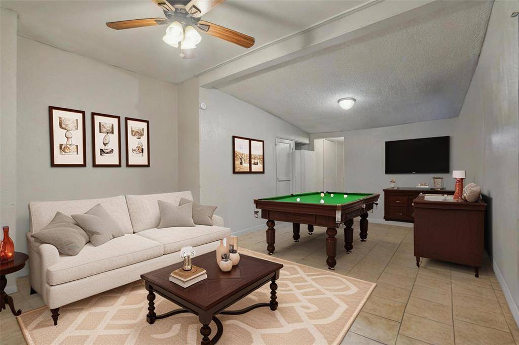 Living room upon entry in unit 1. [virtually staged]