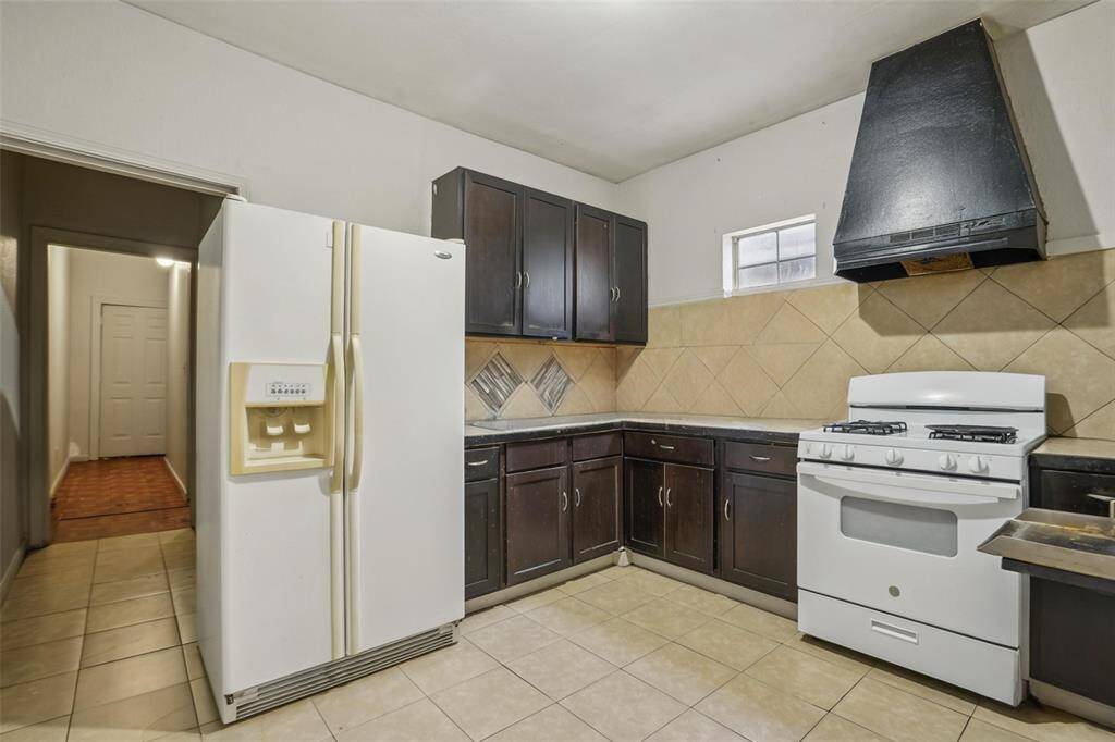 Unit 2 kitchen. [virtually removed all personal items to showcase space]