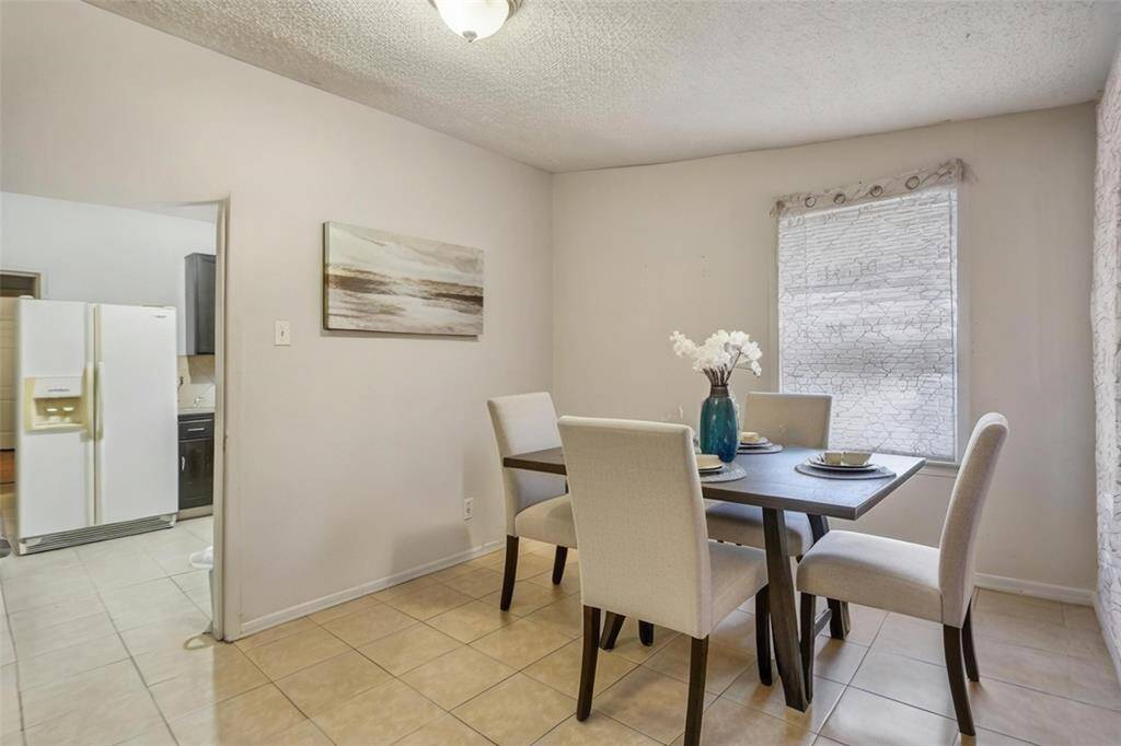 Unit 2 living room upon entry which can be a versitle space. [virtually staged]