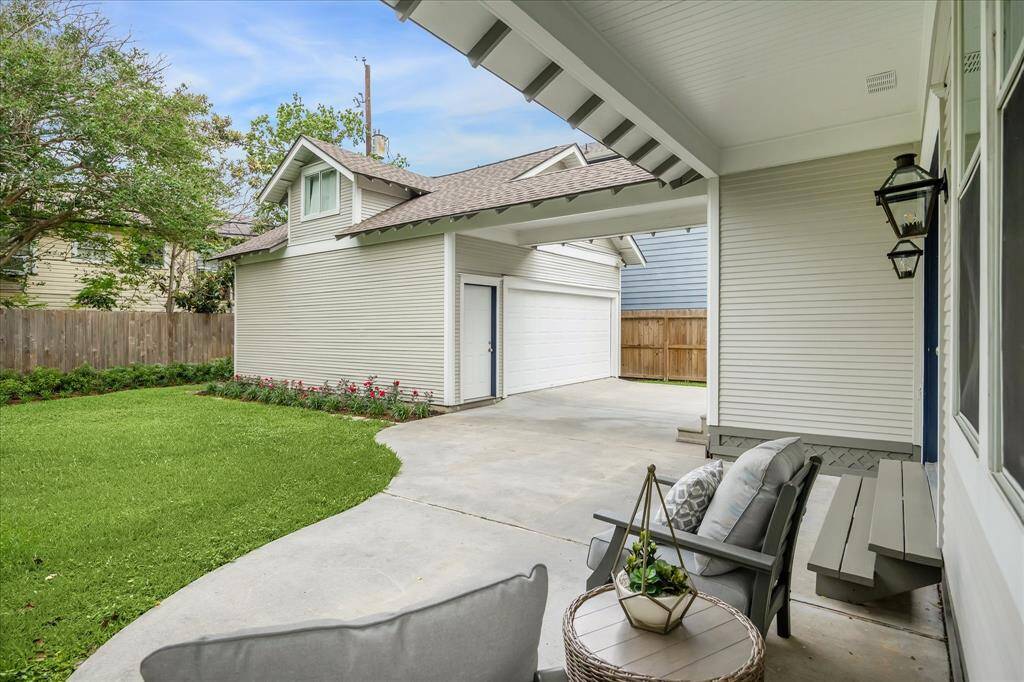 A covered breezeway connects the house to the garage.  There is an air-conditioned storage room on the second level of the garage.