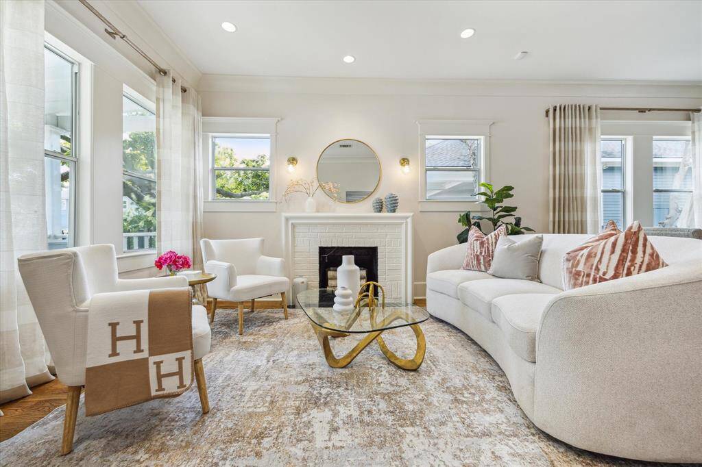 The home features both a light filled front living area and a large den overlooking the patio and backyard.