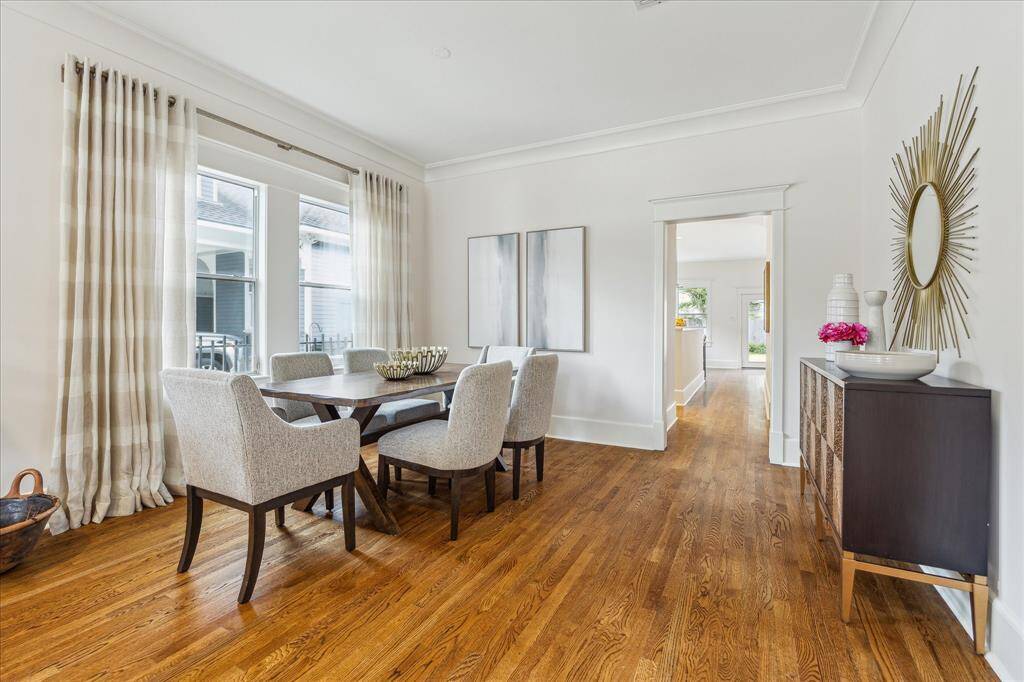The home has hardwood floors throughout the living areas and bedrooms.