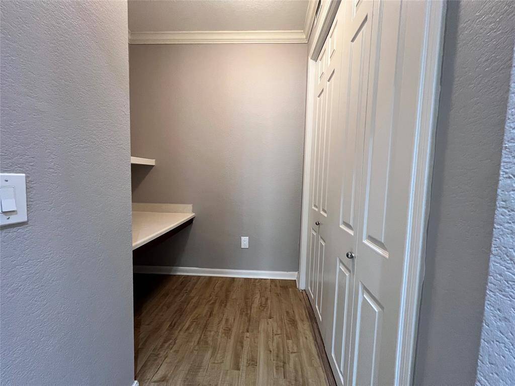Off the living room, is a desk area for those who work from home.  Full-size washer and dryer is behind the folding doors.