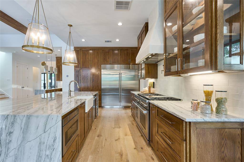 Impressive 72-inch Sub-Zero refrigerator, offering unmatched style and ample storage space for all your culinary needs.