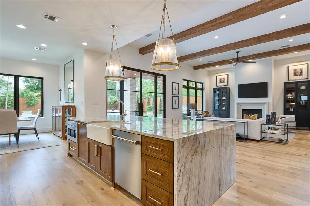 The kitchen overlooks both the family room and dining room, creating an open, interconnected space ideal for entertaining and gatherings.