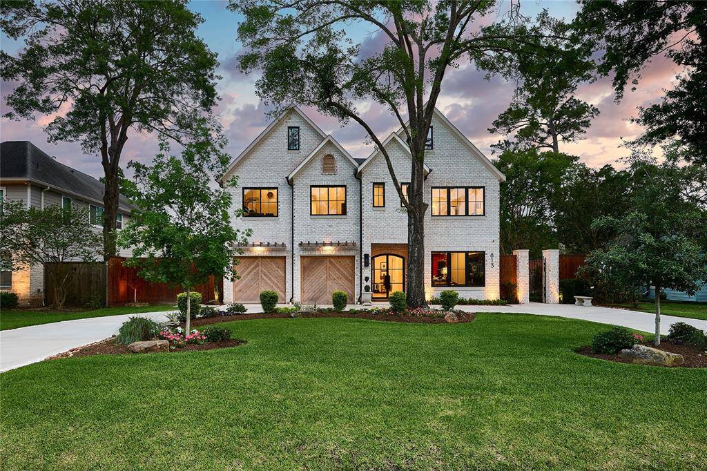 Stunning custom contemporary residence nestled in the highly sought-after Garden Oaks community.