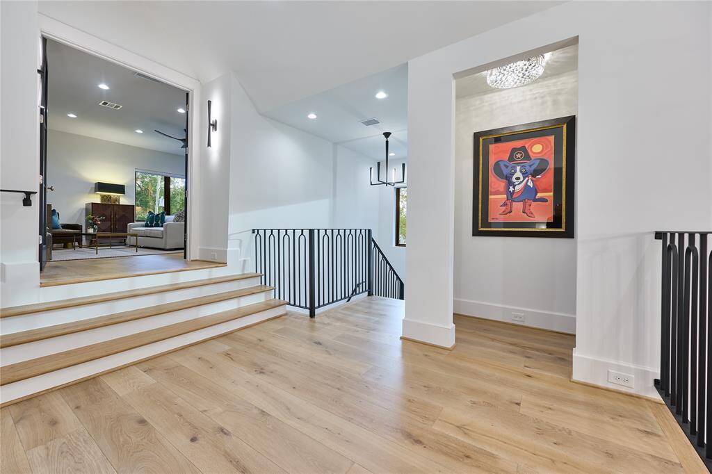 Spacious upstairs landing that gracefully leads to the game room and well-appointed bedrooms, providing a perfect blend of privacy and open living.