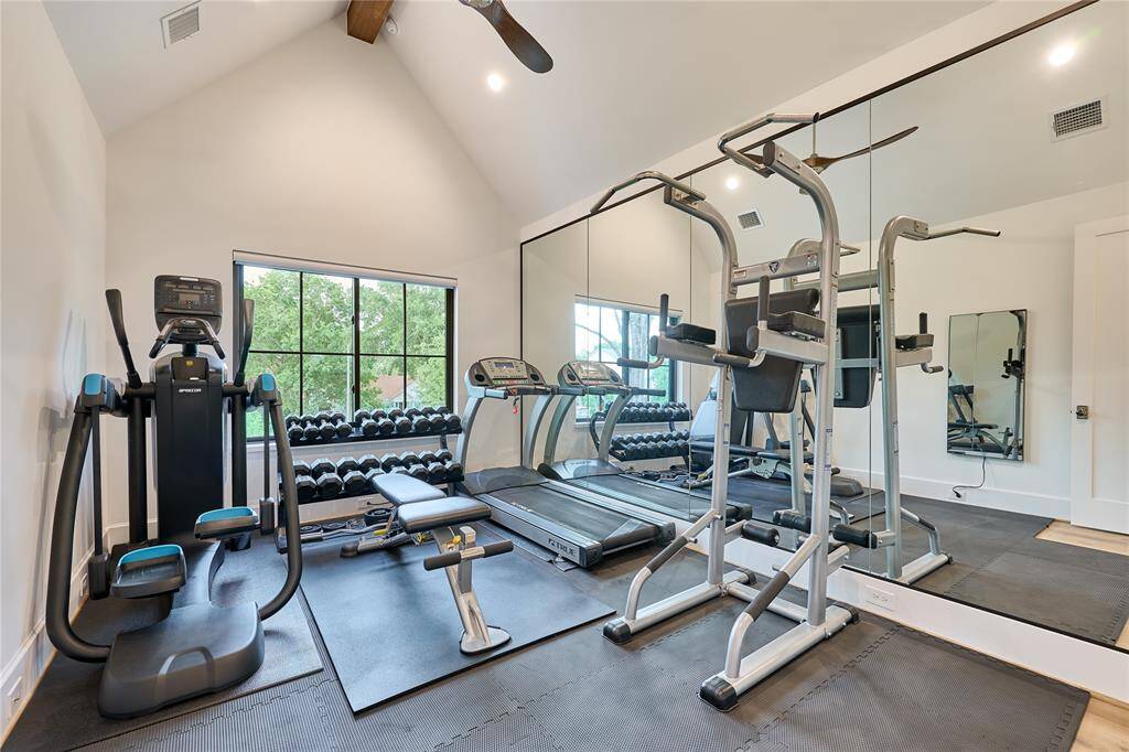 Third guest bedroom, currently utilized as a home gym, offering flexible space that can easily be transformed to suit your needs.