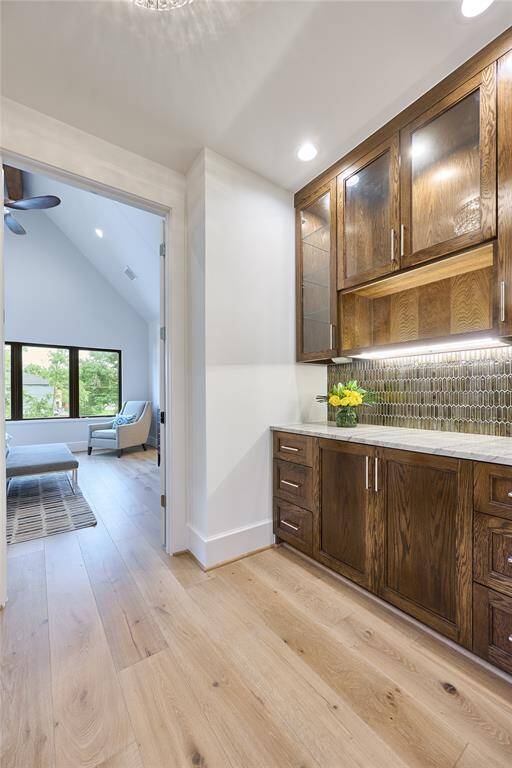 Additional storage area off the primary bedroom, perfectly suited for a home coffee bar or personalized space to suit your needs.
