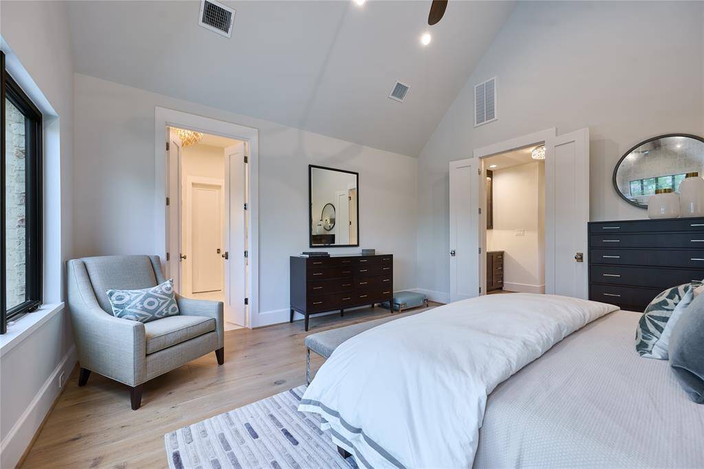 Alternate view of the primary suite, seamlessly leading into the luxurious primary bathroom for a perfect flow between spaces.