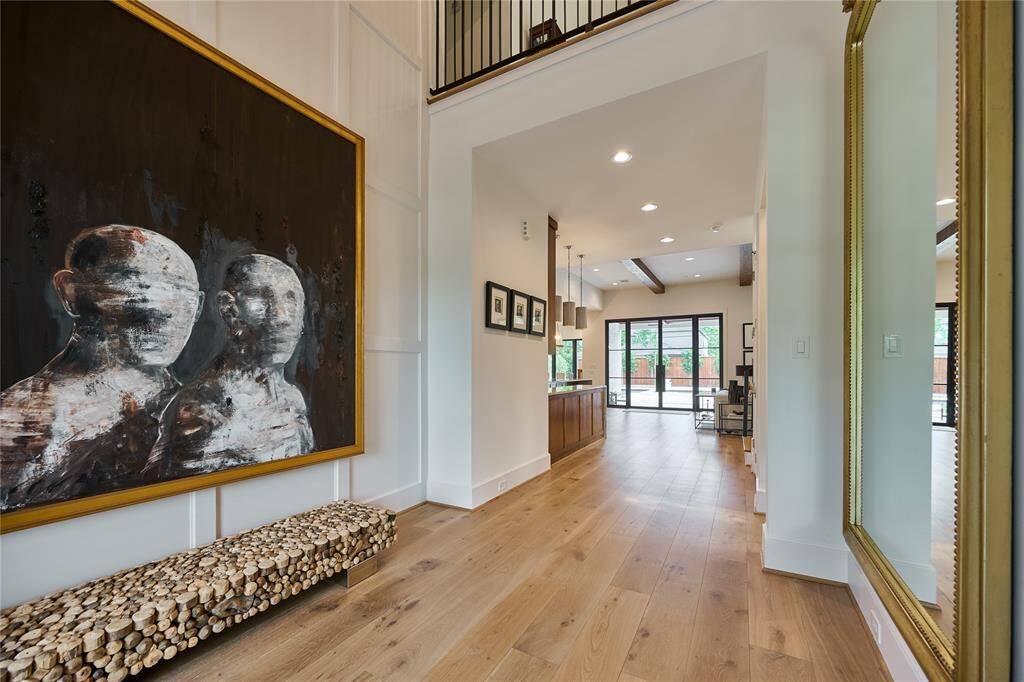 Grand foyer entry with soaring double-height ceilings, setting an impressive tone from the moment you arrive.