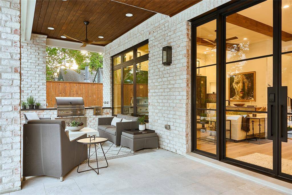 Step outside to a stunning covered patio complete with a fully equipped outdoor kitchen—perfect for year-round entertaining.