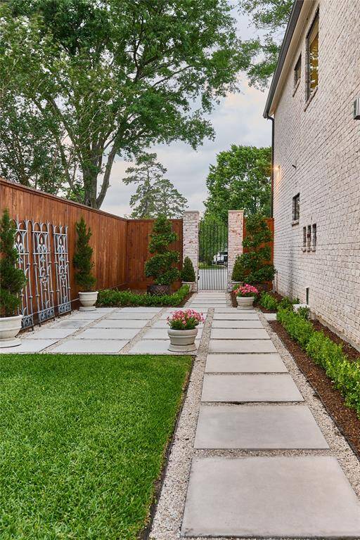 Private side courtyard with dedicated doggie door access—perfect for pets to enjoy the outdoors safely and comfortably.