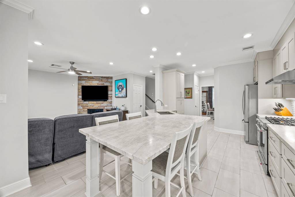 Spacious island with elegant matte quartz countertops, perfect for extra seating.