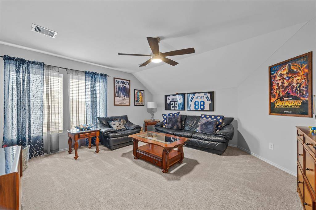 Spacious second-floor game room, perfect for family game nights and entertainment.