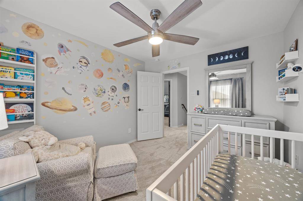Spacious fourth bedroom perfect for family comfort and versatility.