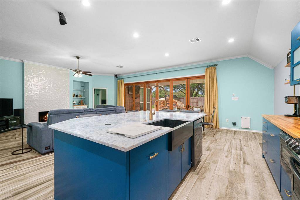 This modern kitchen opened into the bright living room and sunlit breakfast nook, forming a perfect triangle for daily life and entertaining. Cook, dine and lounge without boundaries in this light-filled open concept space designed for making memories.The thoughtful layout blends contemporary style with functional design, offering both grand-scale entertaining potential and cozy everyday comfort.