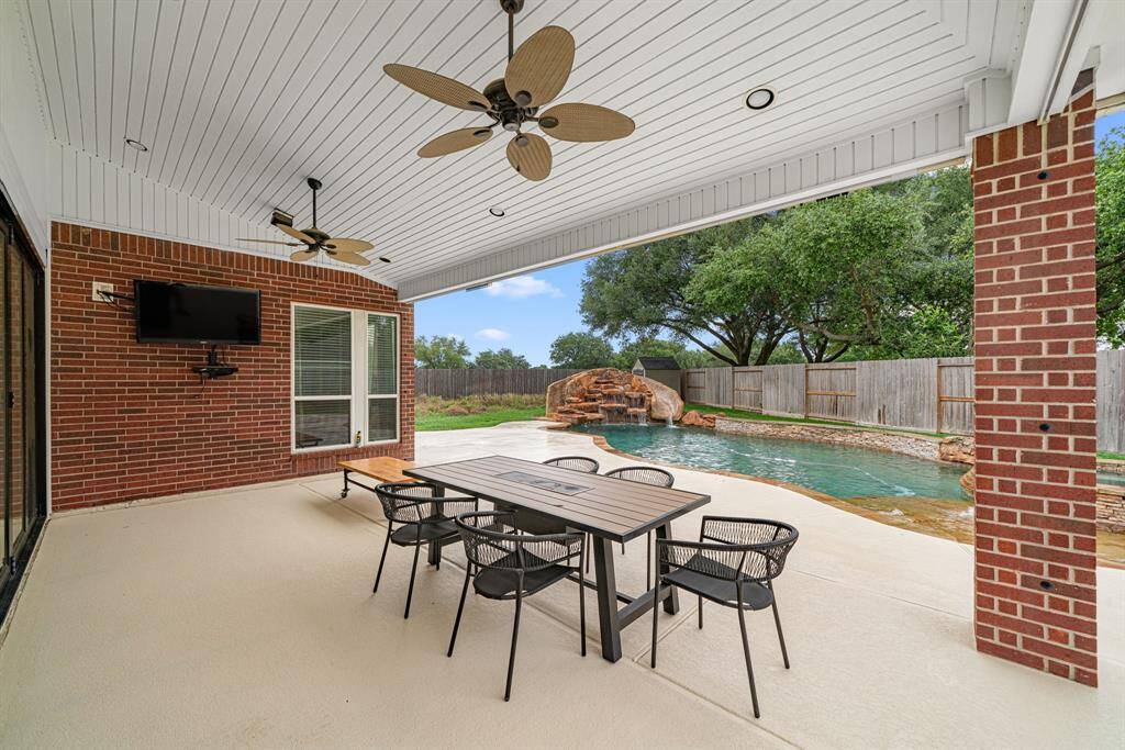The expansive covered patio offers year-round enjoyment with: A refreshing misting system for warm days. Entertainment-ready setup with TV and recessed lighting, Dual ceiling fans to keep the space breezy and comfortable.