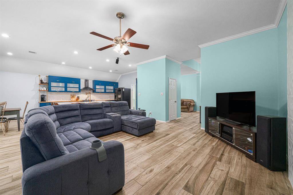 This airy great room connects directly to your sleek, modern kitchen and sunlit breakfast nook, forming a perfect triangle for daily life and entertaining. Cook, dine and lounge without boundaries in this light-filled open concept space designed for making memories.
