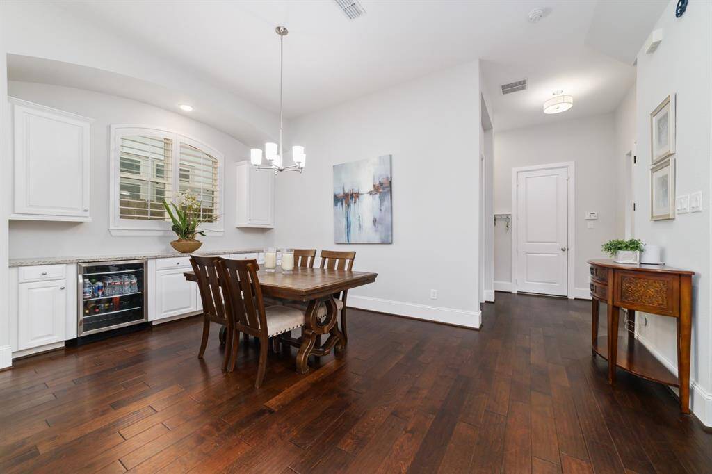 Formal/casual dining room opens up to the living and kitchen.