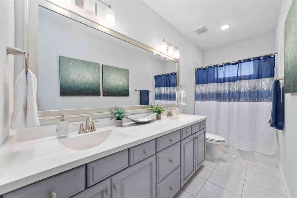 Full bathroom with duel sink. Shared with both secondary bathrooms.