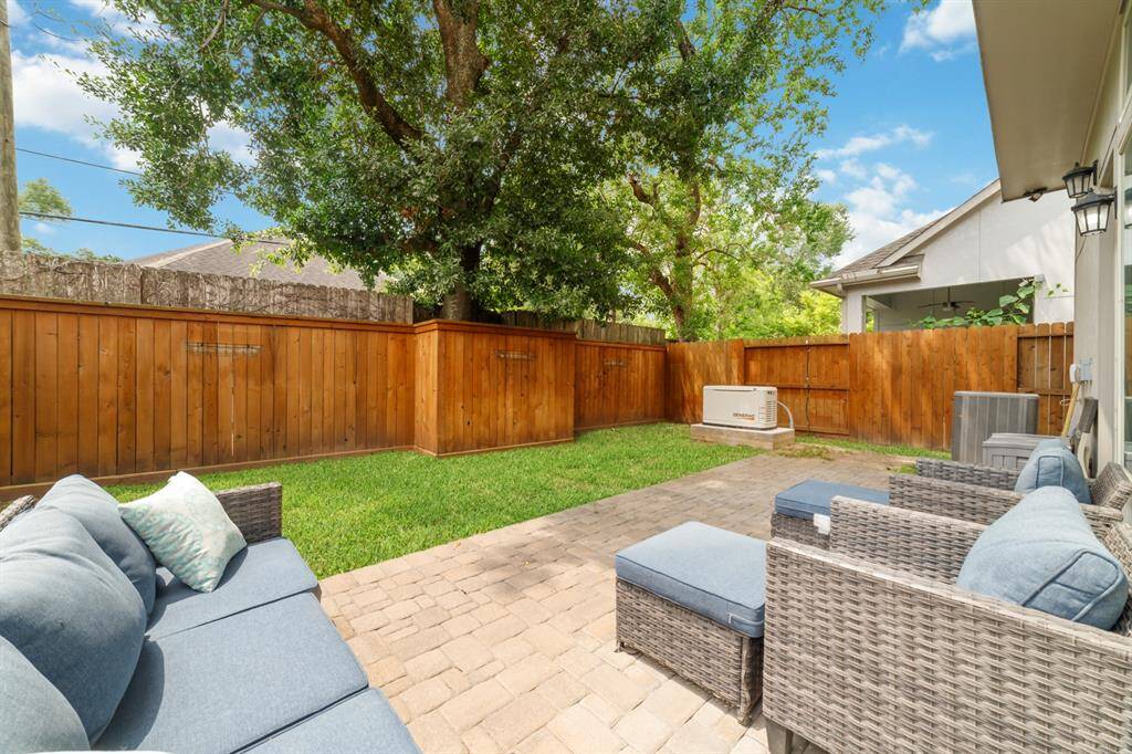 This backyard has privacy and a great space to entertain your guests!