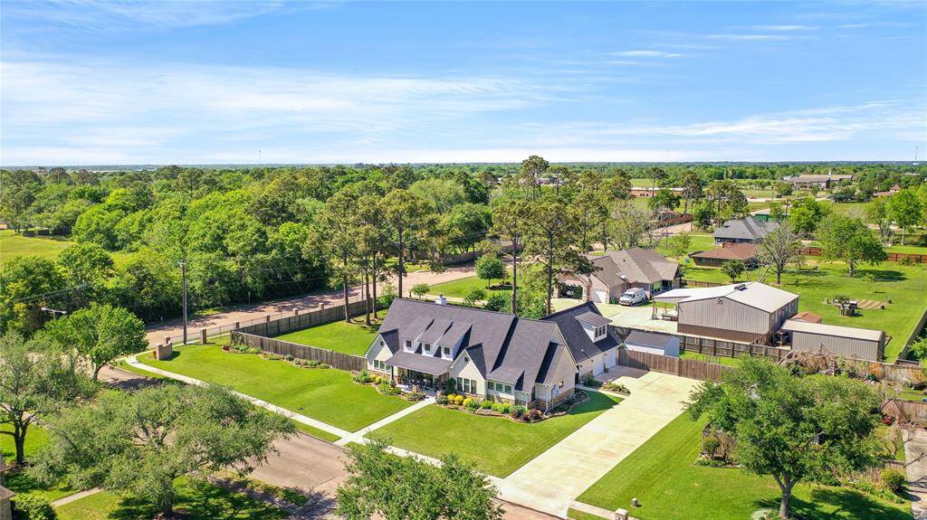 Huge corner lot with 31,755 sqft, expanded driveway, room for a pool, and so much more!