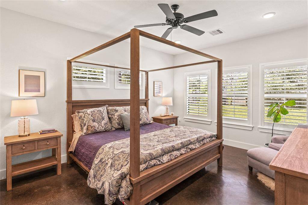 Primary Bedroom over looking the gorgeous backyard with primary en suite.