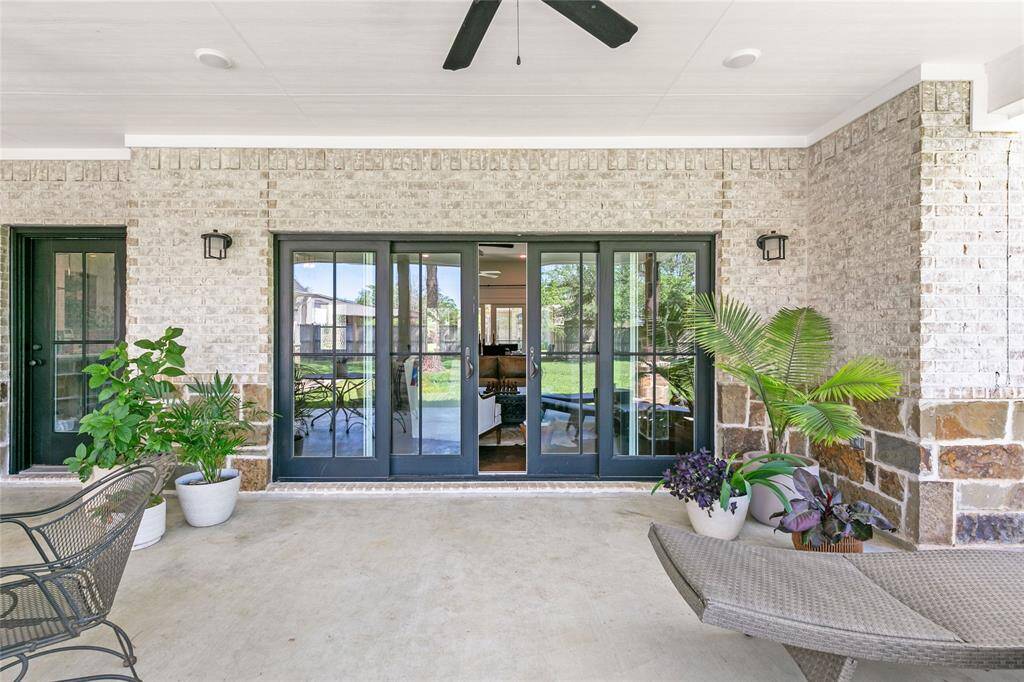 Sliding french doors off of the living room open up to back porch.