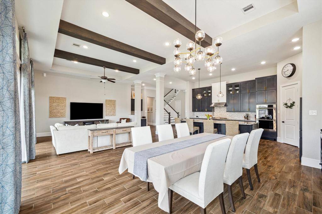 Your friends and family will love gathering in this elegant and open dining area, offering ample space for a banquet table and sideboard.