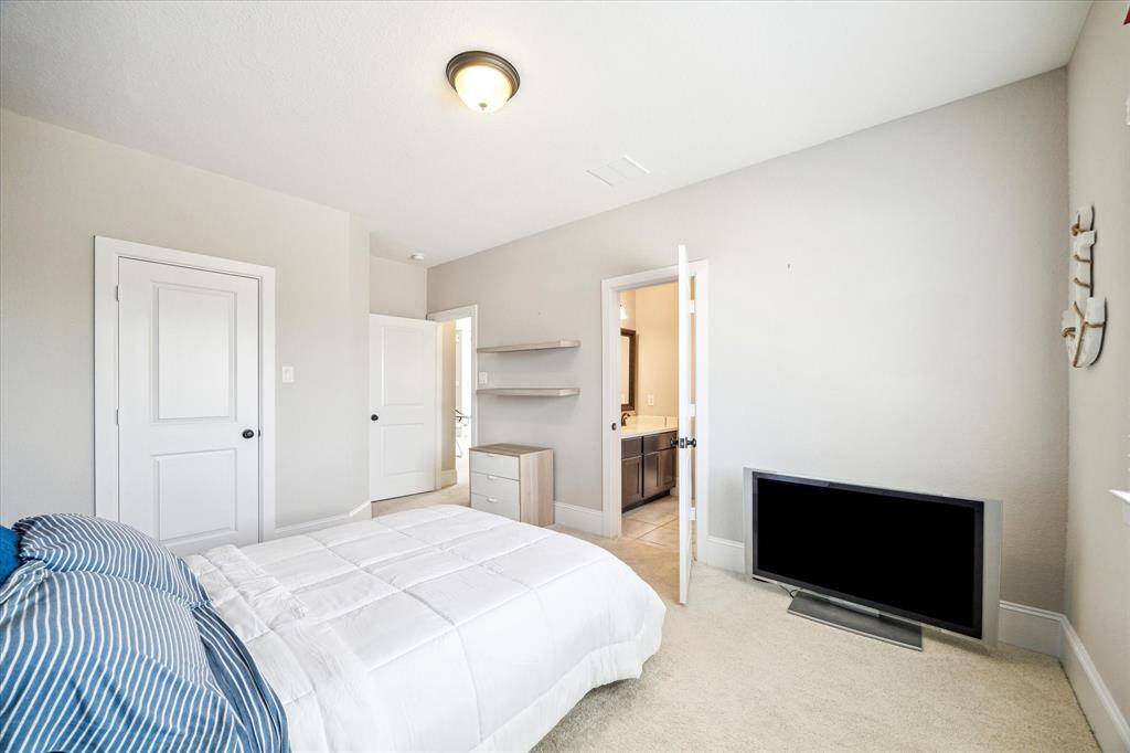 This is one of two guest suites upstairs. As you can see, this bedroom is very spacious with plenty of room for furniture, games, toys and more.