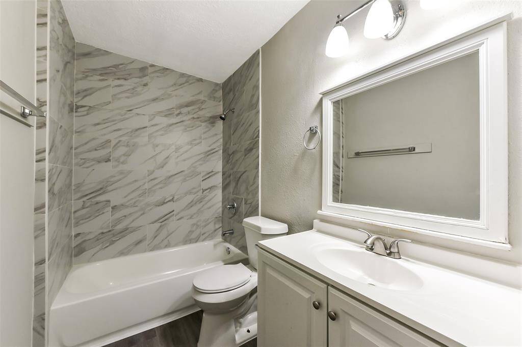 Primary bath has Tub and Tile Shower surround in modern finishes