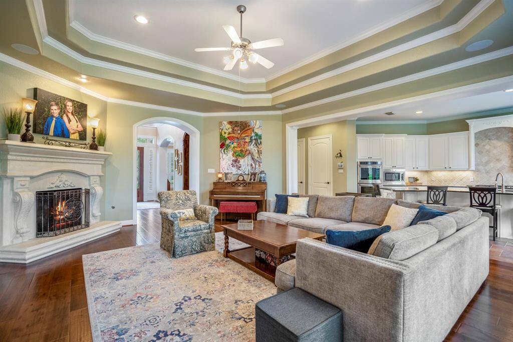A large cast stone fireplace offers center stage in the living room, and offers a cozy retreat to relax.
