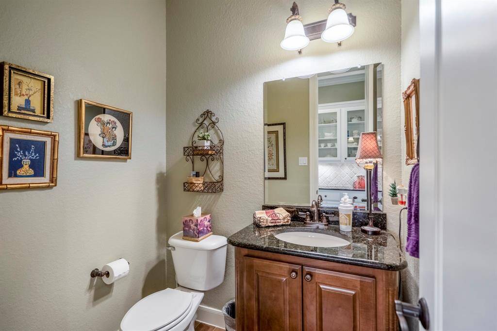 The guest bathroom offers a convenient freshening up location, just opposite the Butler's Pantry.