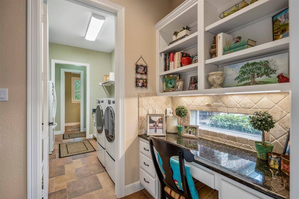 A hidden gem is this work from home area that is just off the laundry room and kitchen area where the window provides natural lighting, also on offer is undercounter lighting, and a built-in desk.