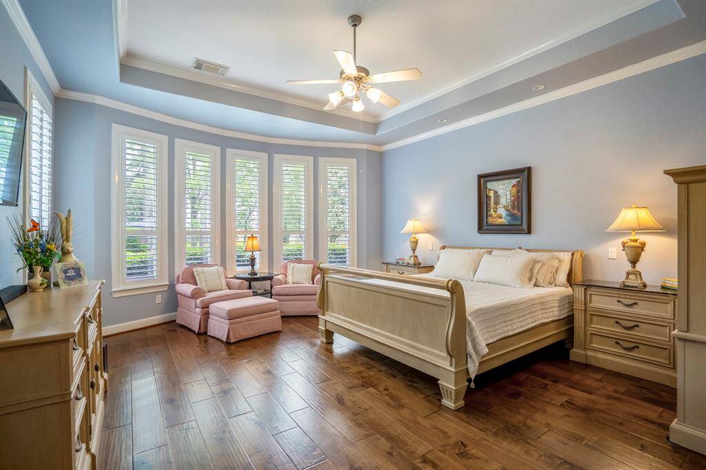 Looking for a haven, this bedroom suite has been painted in colors to offer a serene environment, offering an elegant and relaxed primary bedroom retreat.